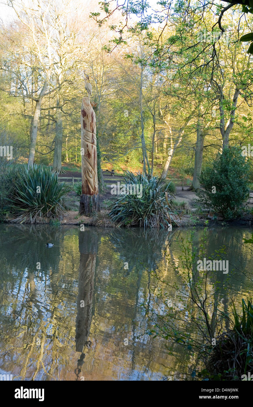 Holly hill woodland park totem pole in warsash Hampshire Stock Photo