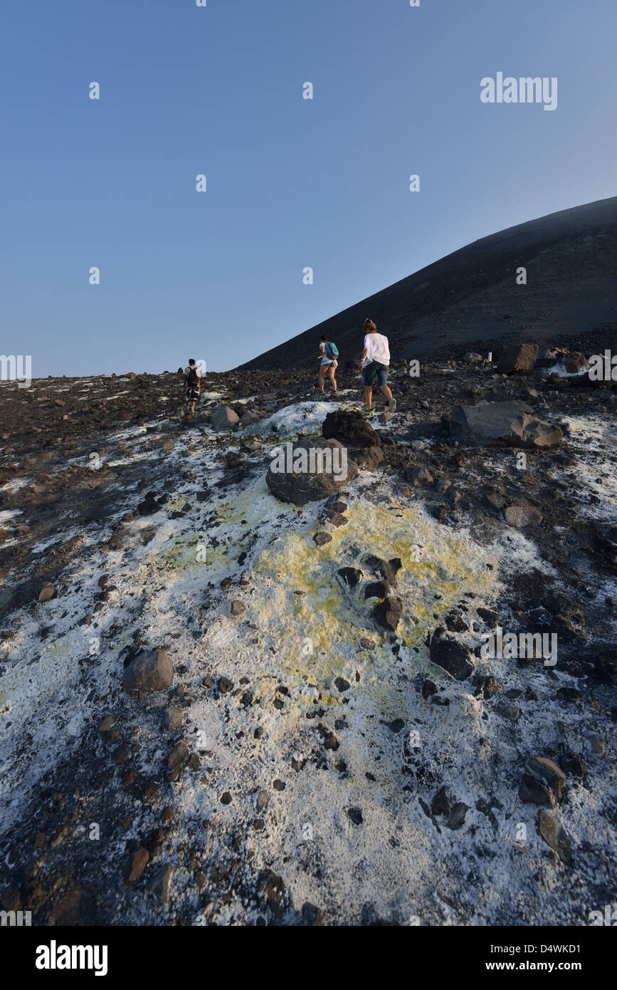 Tourists on the steep slopes of Anak Krakatau; Western Java, Indonesia. Stock Photo