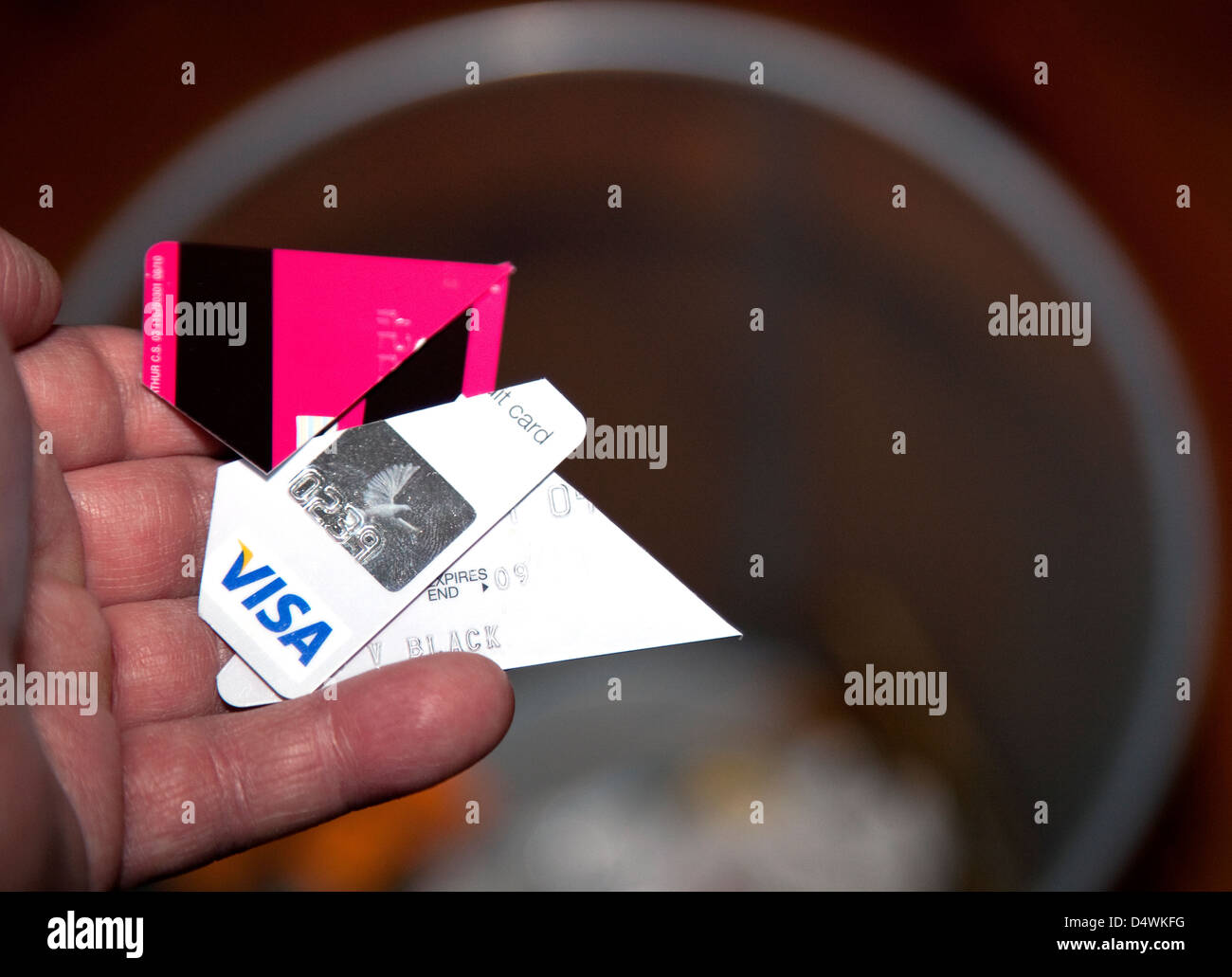 Throwing away cutup credit card, London Stock Photo Alamy