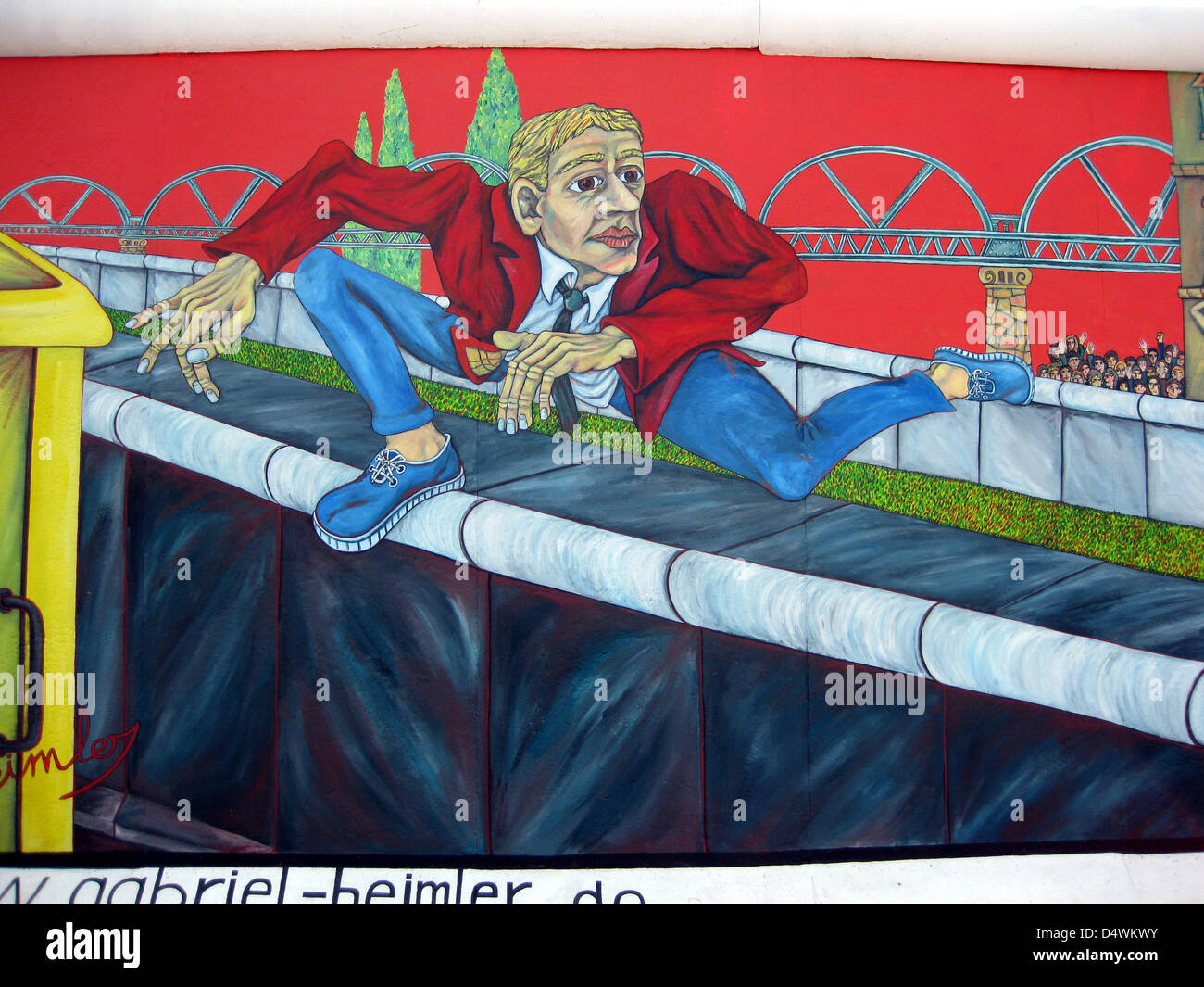 The artwork by Gabriel Heimler, 'Der Mauerspringer' (The Wall Vaulter), is pictured on a section of the Berlin Wall at the East Side Gallery on Mühlenstrasse in Berlin, Germany, in August 2009. The concrete parts of the Berlin Wall between Ostbahnhof and Warschauer Strasse were painted by international artists after the opening of the inner-German border in November 1989. Photo: Dieter Palm Stock Photo