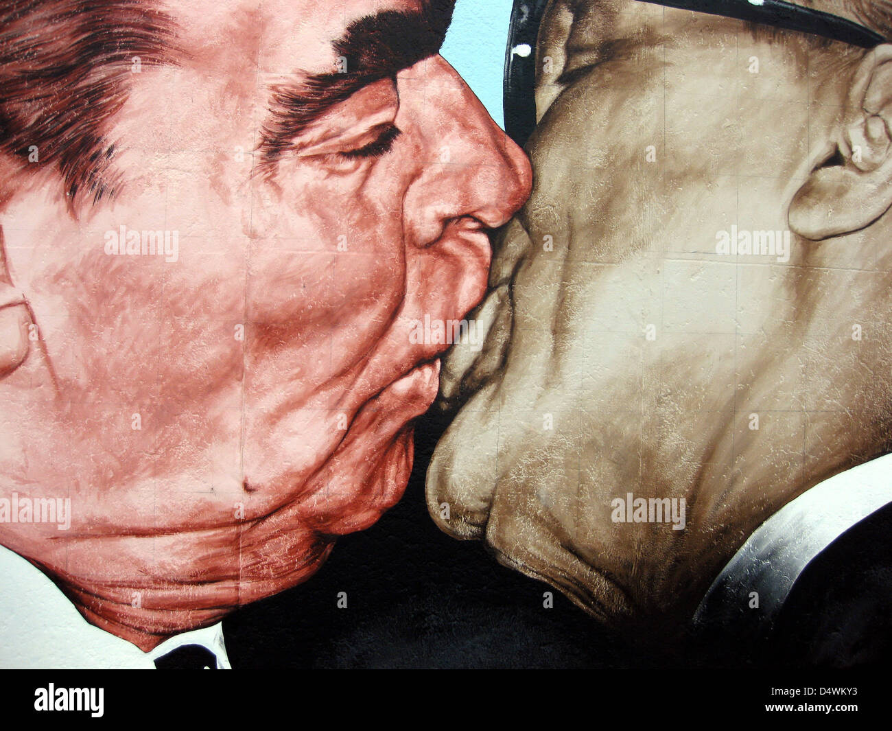 The artwork by Dimitri Vrubel, 'Der Bruderkuss' (The Socialist Fraternal Kiss), is pictured on a section of the Berlin Wall at the East Side Gallery on Mühlenstrasse in Berlin, Germany, in August 2009. The most famous artwork of the East Side Gallery shows the socialist fraternal kiss between SED General Secretary Erich Honecker and General Secretary of the Soviet Union Leonid Brezhnev. The concrete parts of the Berlin Wall between Ostbahnhof and Warschauer Strasse were painted by international artists after the opening of the inner-German border in November 1989. Photo: Dieter Palm Stock Photo