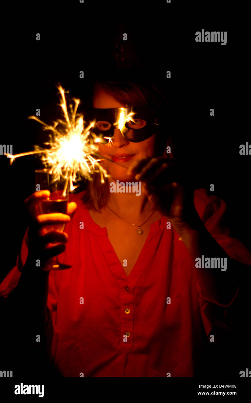 Woman with sparkler Stock Photo