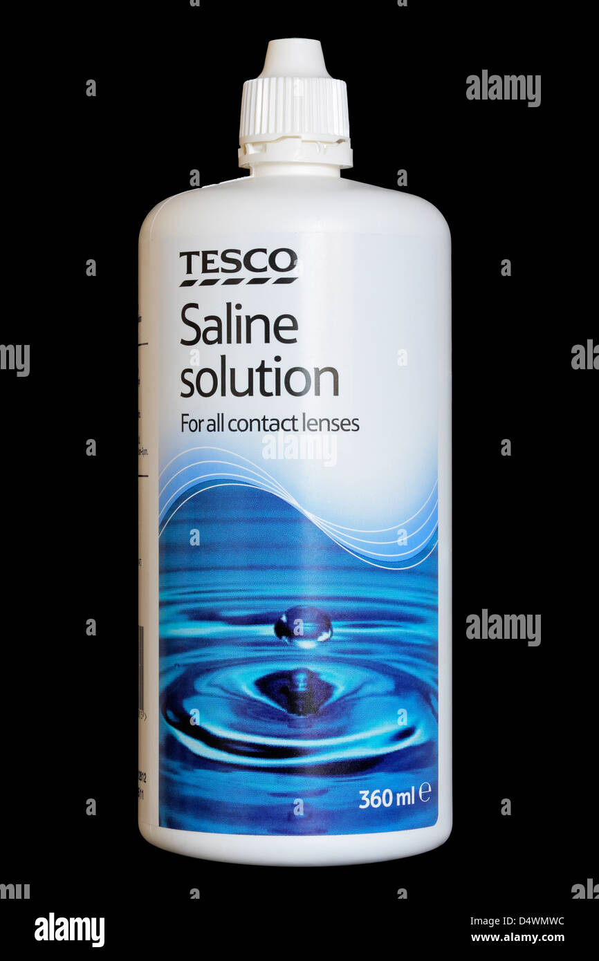 Tesco Contact Lens Saline Solution for storing and cleaning contact lenses isolated on black background Stock Photo