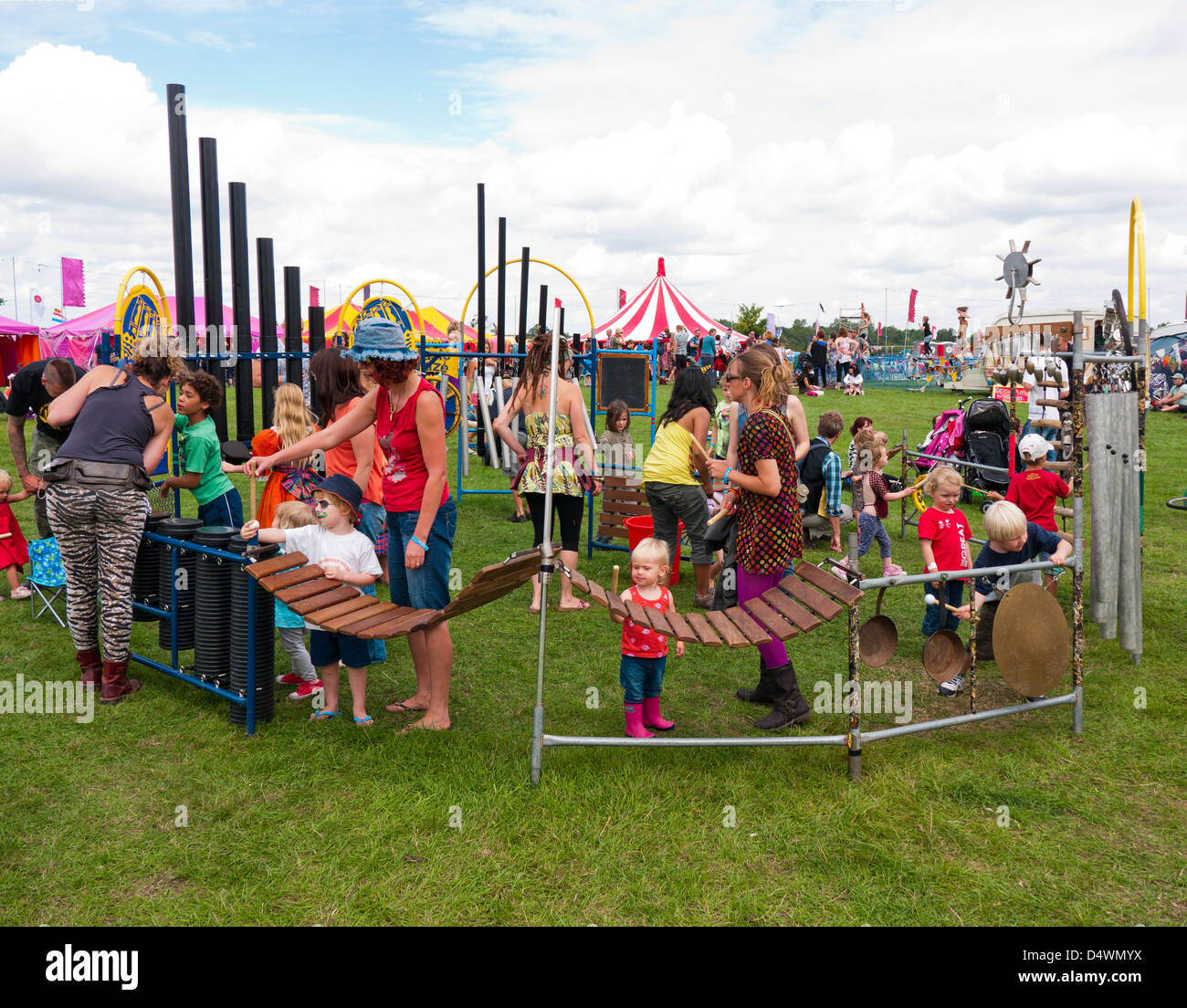 Children playing musical instruments in the kids field at Shambala festival Stock Photo