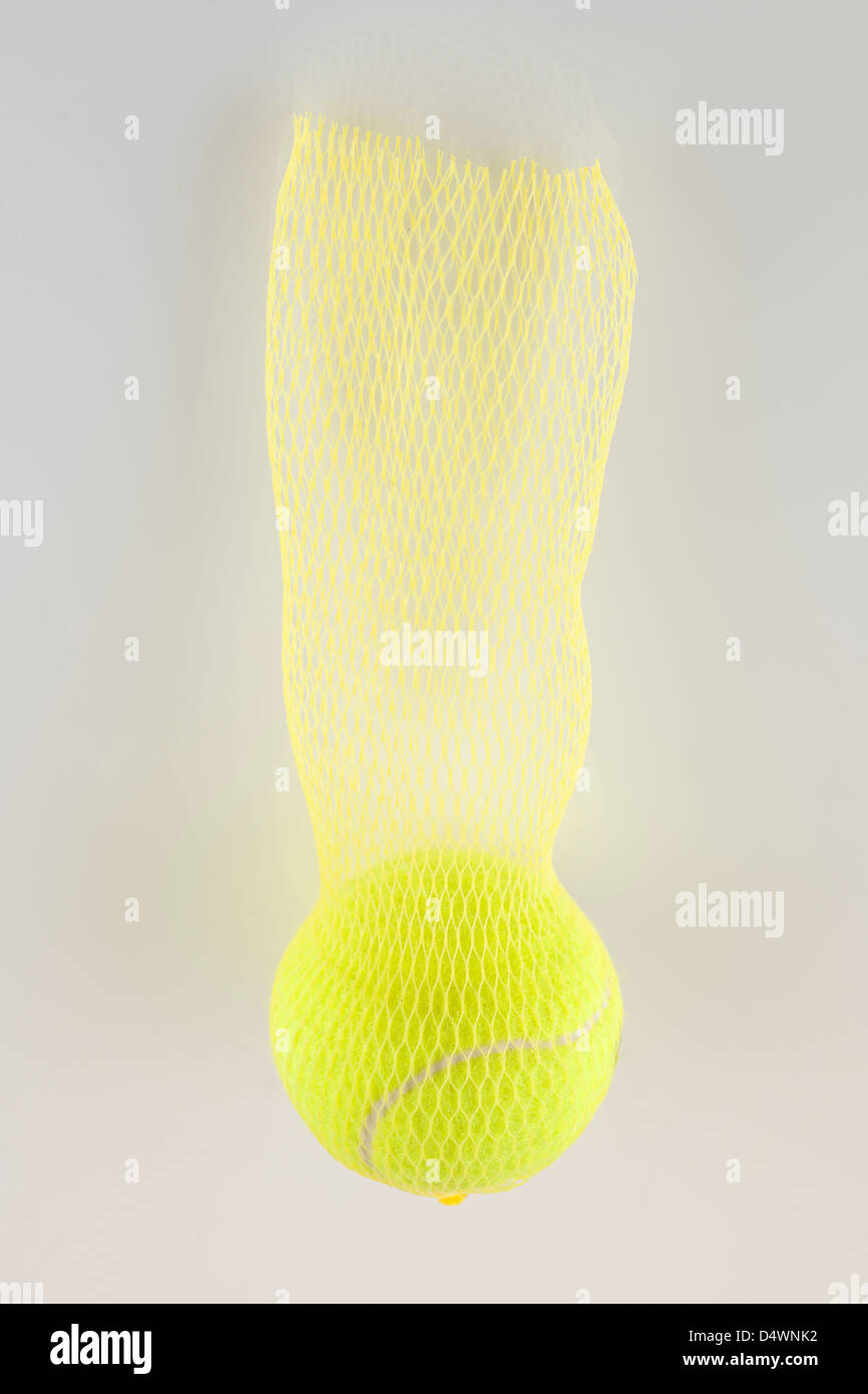 Yellow ball in a nylon yellow mesh net Stock Photo