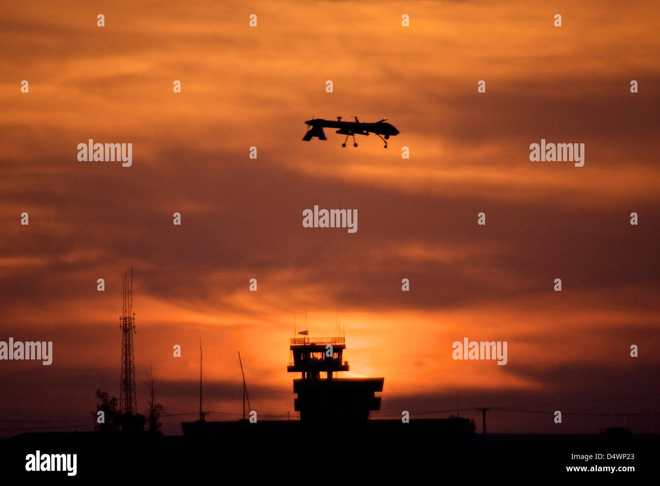A MQ-1 Predator over COB Speicher at sunset, Tikrit, Iraq. Stock Photo