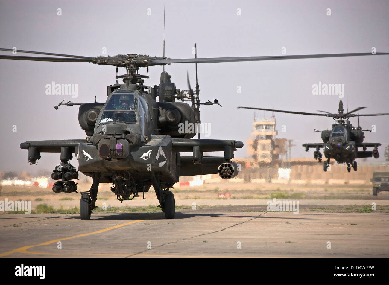 Two AH-64 Apache helicopters return from a mission over Northern Iraq during Operation Iraqi Freedom. Stock Photo