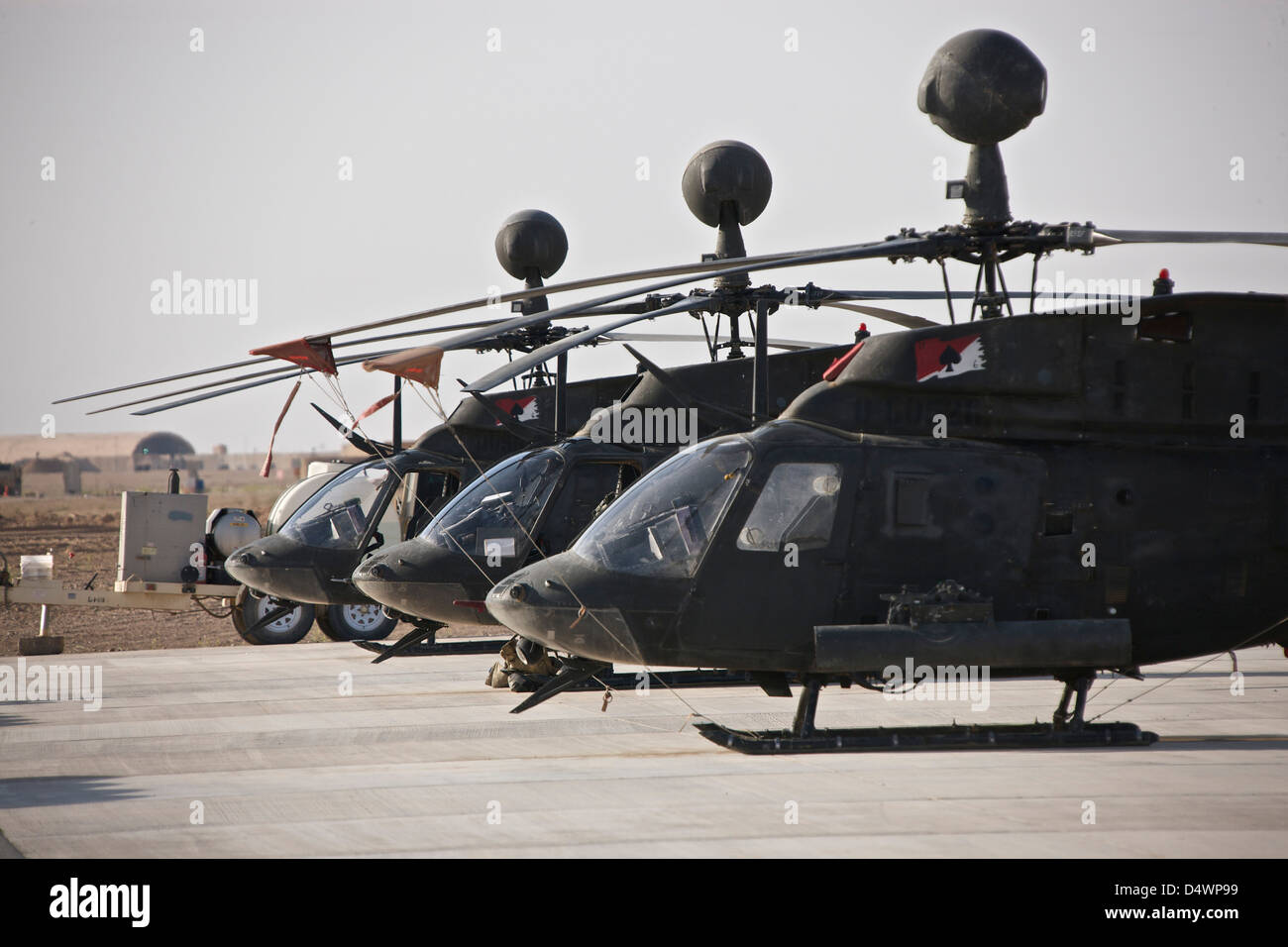 OH-58D Kiowa helicopters on the flight line at COB Speicher, Tikrit, Iraq, during Operation Iraqi Freedom. Stock Photo