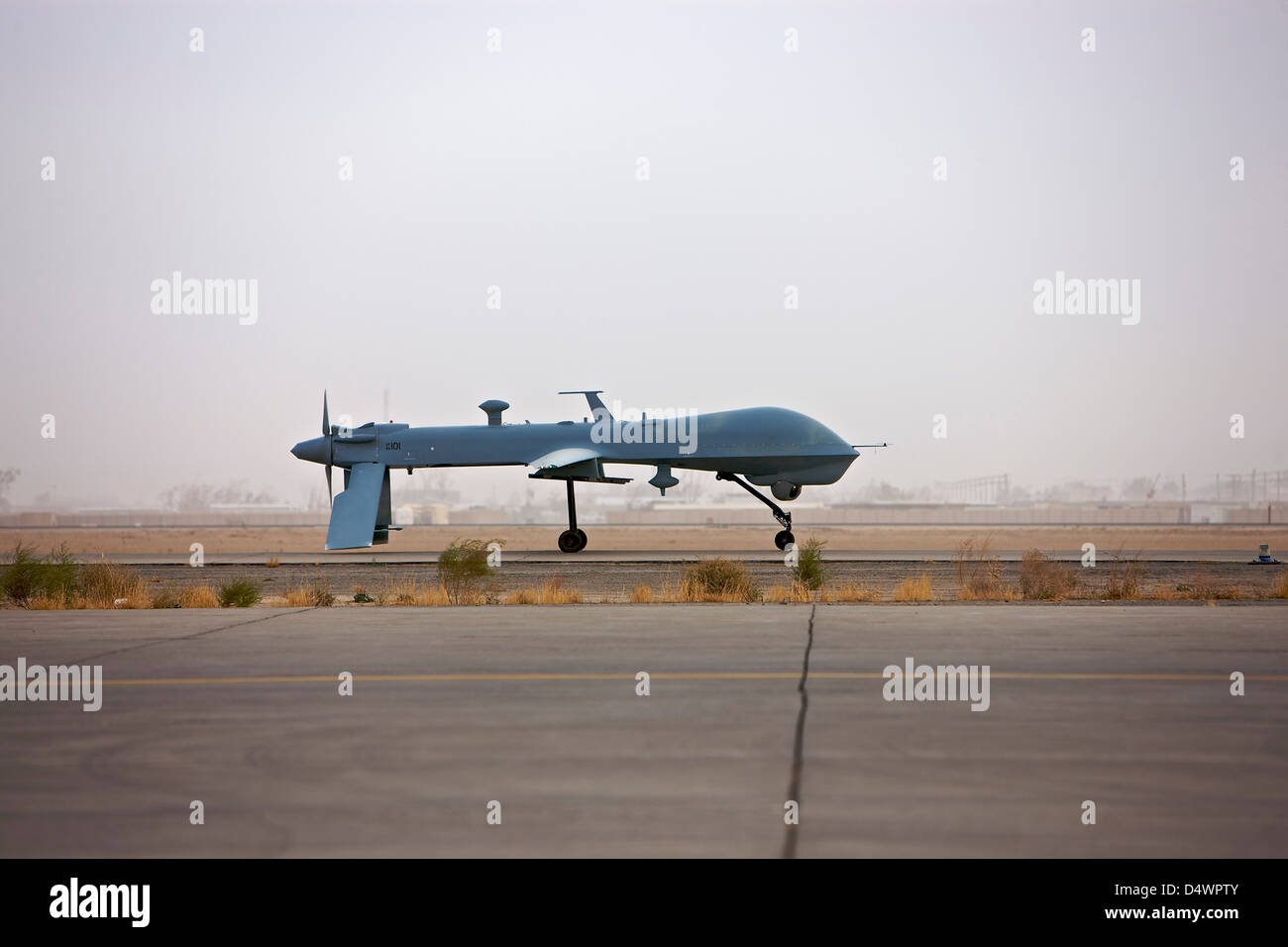 A MQ-1 Predator unmanned aerial vehicle taxiing at COB Speicher, Tikrit, Iraq, during Operation Iraqi Freedom. Stock Photo