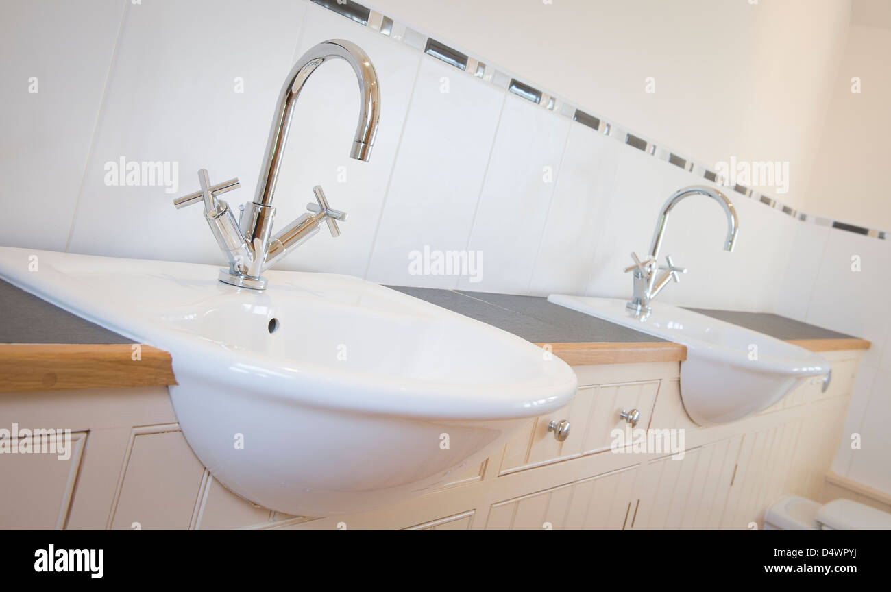 Close up of his and her sinks in a newly decorated bathroom Stock Photo ...