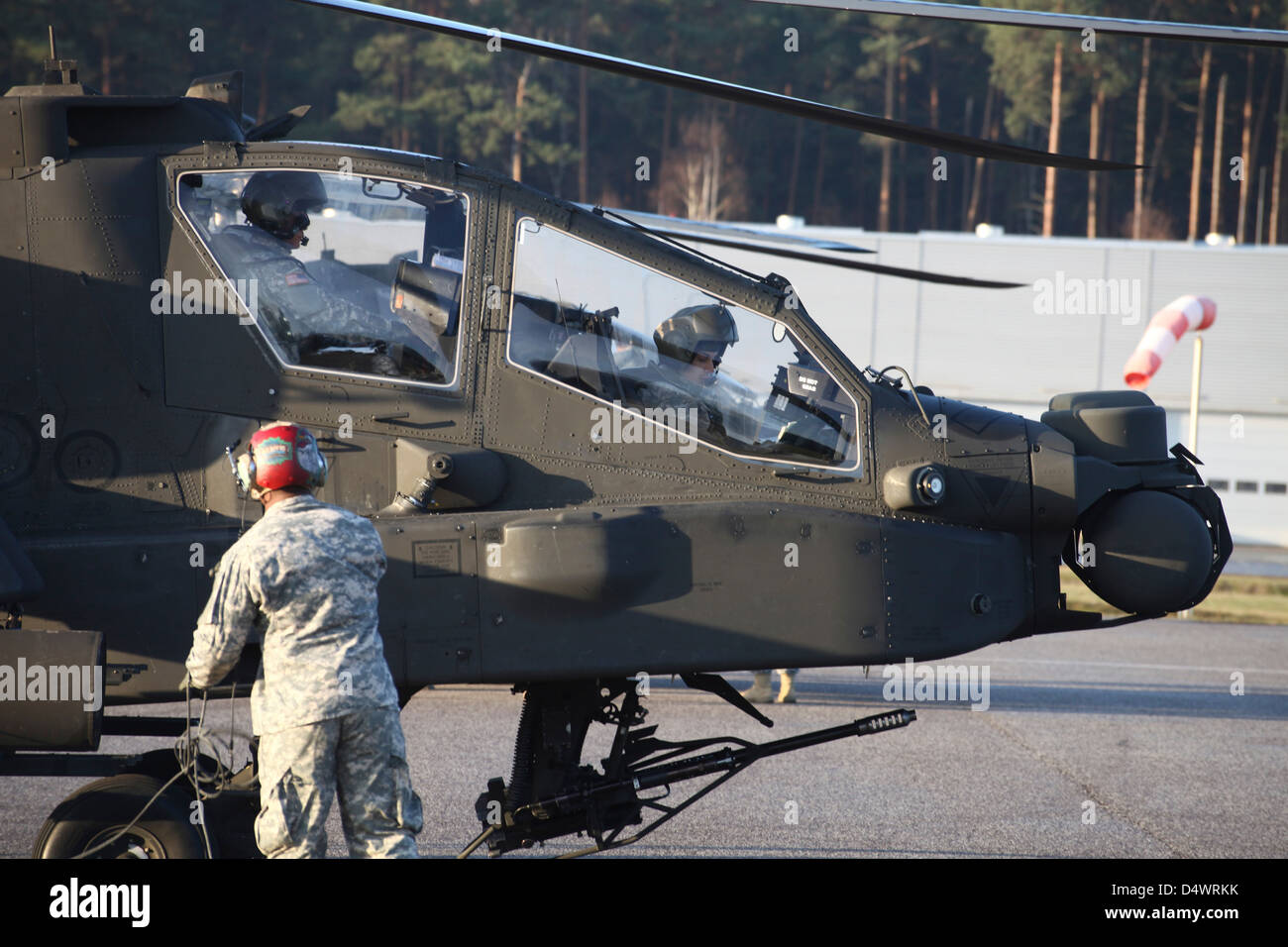 U.S. Army AH-64D Apache helicopter pilots conduct preflight checks at Letzlingen Army Training Center, Germany. Stock Photo