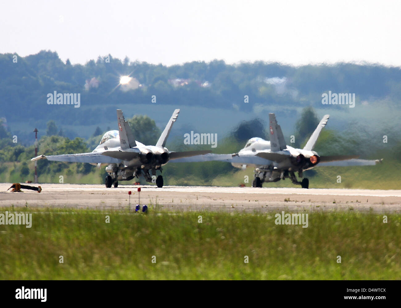 Two F-18C Hornets of the Swiss Air Force armed with AIM-120 AMRAAM missiles during exercise ELITE, Neuburg Airfield, Germany. Stock Photo