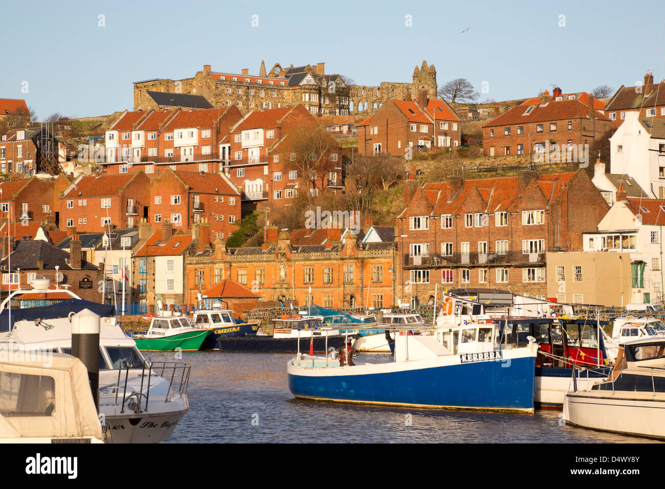 Whitby harbour with Abbey and Youth Hostel in the background Stock Photo
