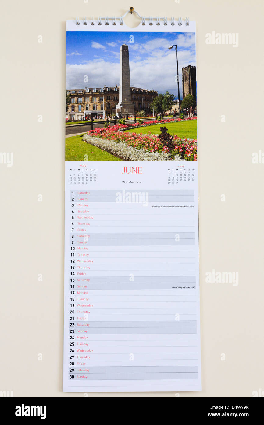 Blank pictorial calendar with photograph of Harrogate showing days and dates for month of June 2013 hanging on a wall Stock Photo