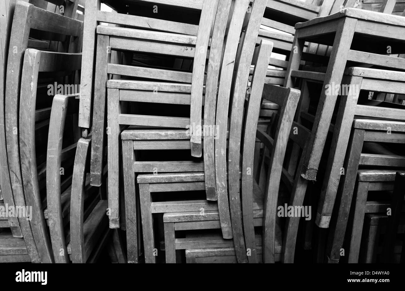 Stacked wooden chairs. Stock Photo