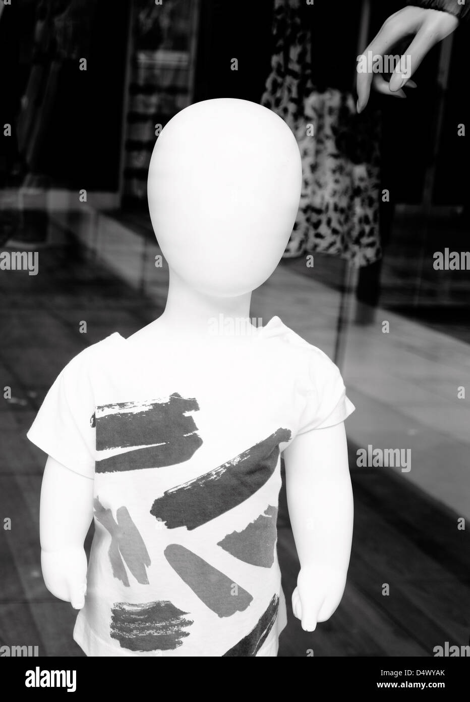 Boy child mannequin in a shop window. Stock Photo