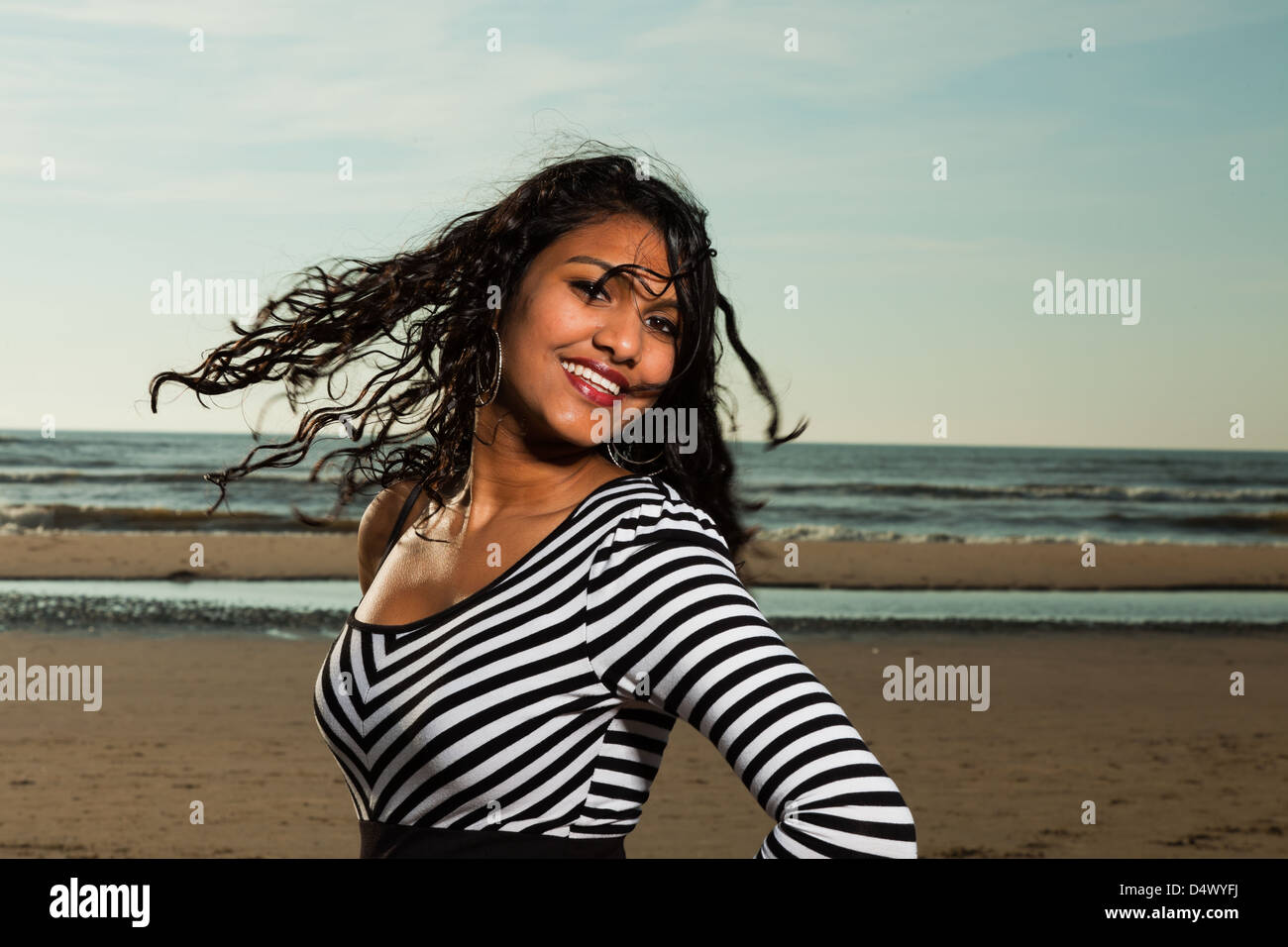 Pretty indian girl with long hair on the beach in summer Stock Photo ...