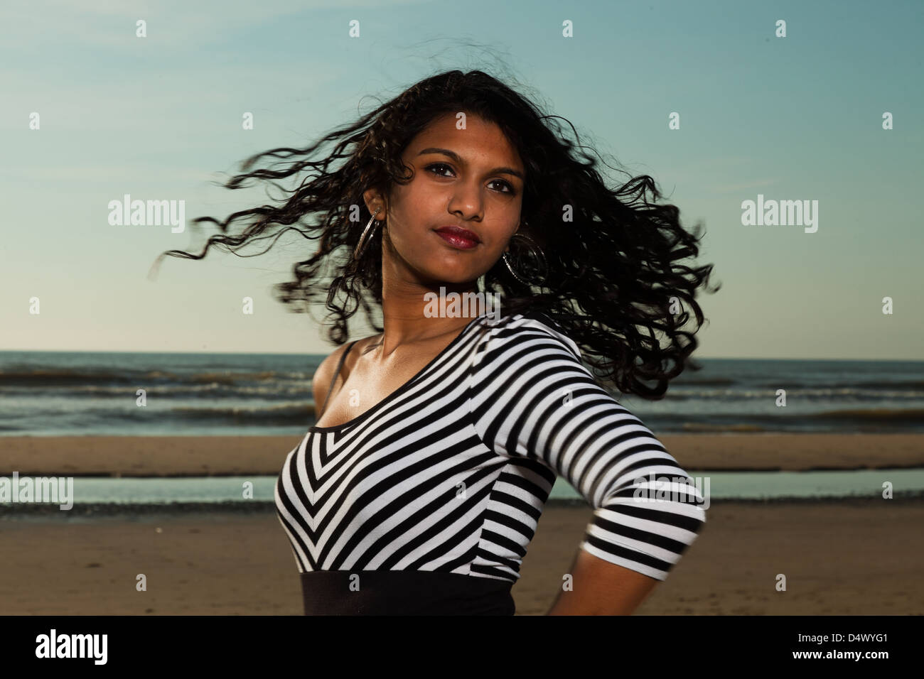 Pretty indian girl with long hair on the beach in summer Stock Photo ...