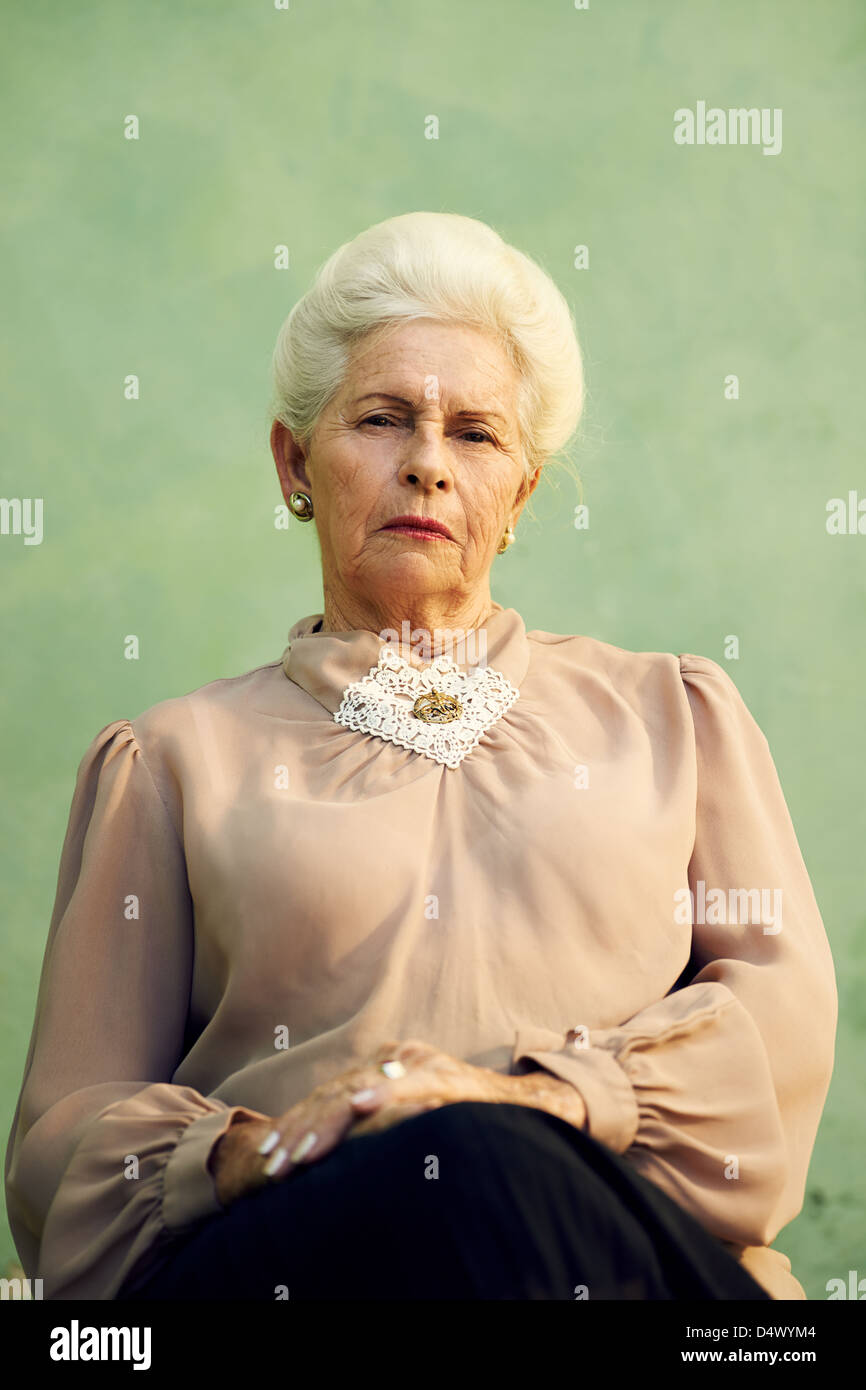 Elderly women and feelings, portrait of serious senior caucasian woman