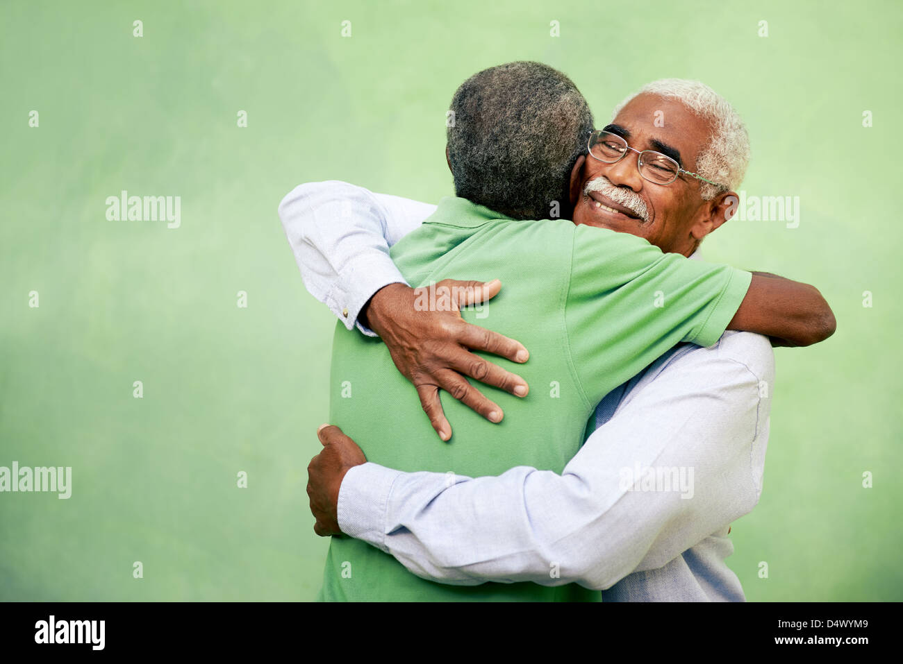 Active retired old men and leisure, two senior black brothers hugging outdoors Stock Photo