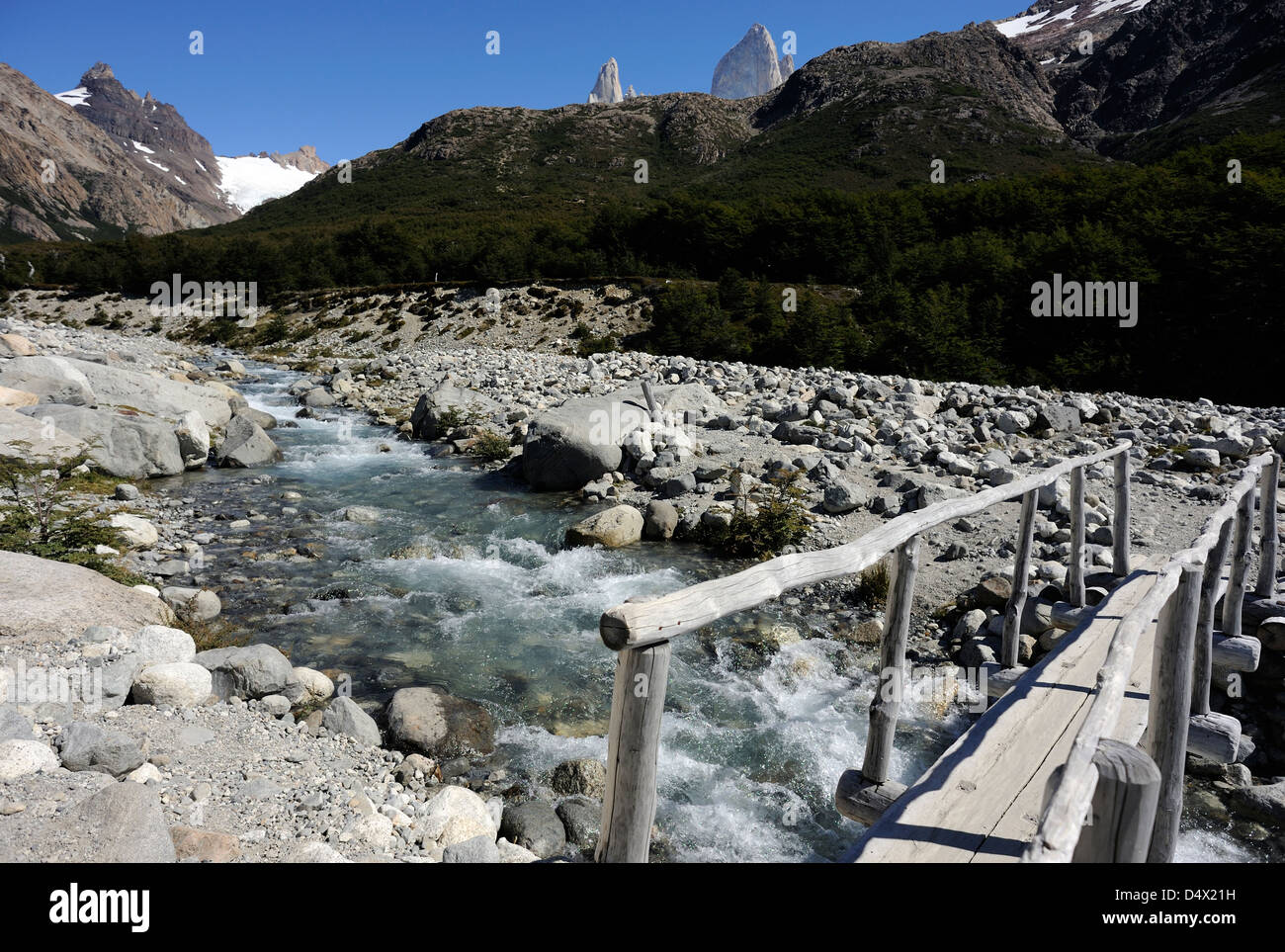 Bridge over a stream in Los Glaciares National Park at the foot of the Fitzroy Range near El Chalten. Argentina. Stock Photo