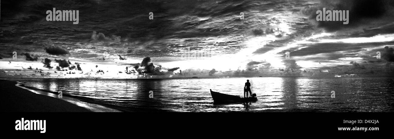 Image of a boat in the Sunset Stock Photo - Alamy