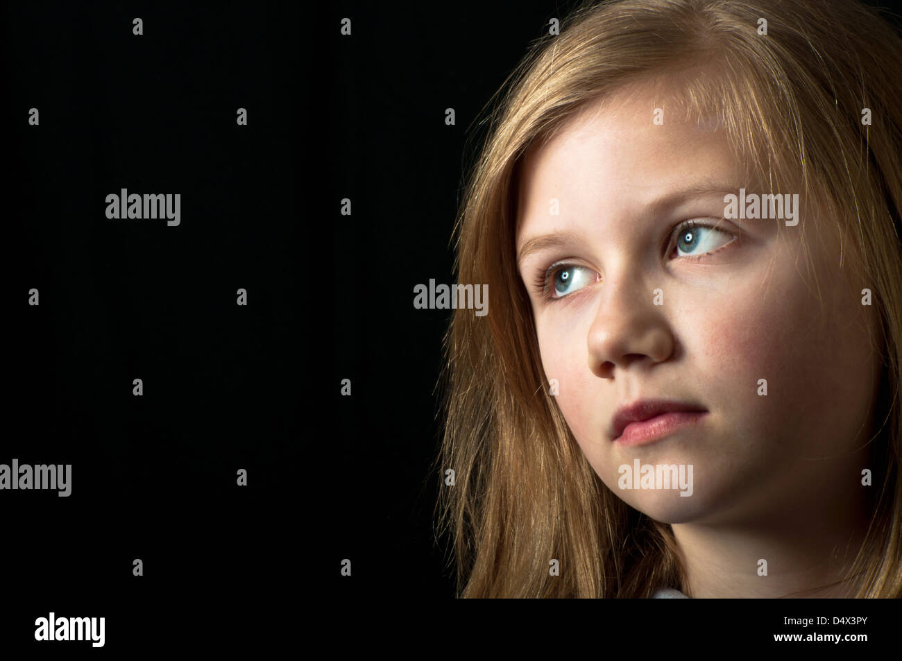 Scared child a victim of abuse Stock Photo