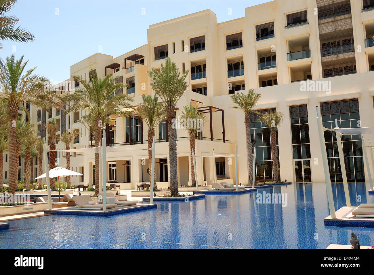 Huts at swimming pool of the luxury hotel, Saadiyat island, Abu Dhabi, UAE Stock Photo