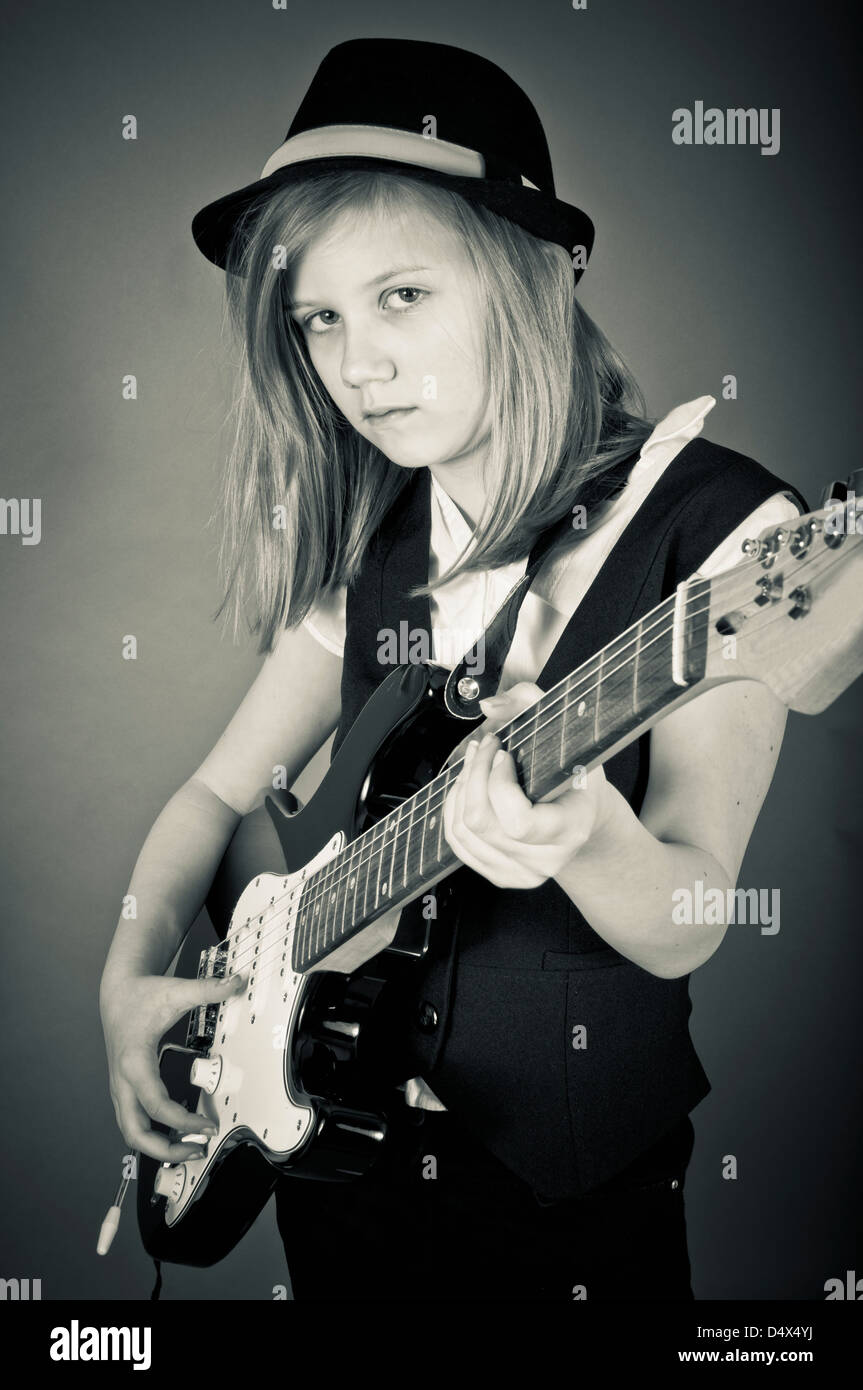 Girl playing the electric guitar Stock Photo - Alamy