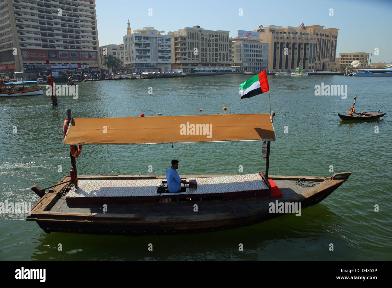 Traditional Abra water taxi crossing the Dubai Creek, United Arab Emirates Stock Photo