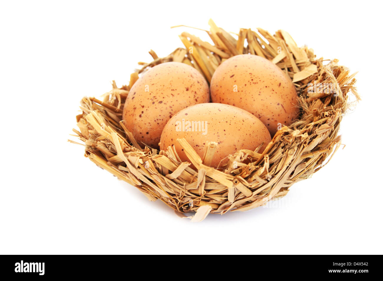 Easter eggs nest isolated on white background Stock Photo - Alamy