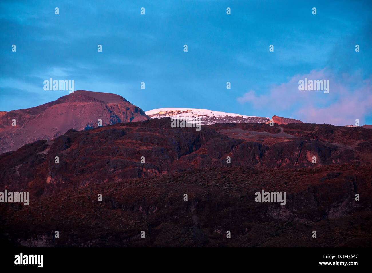 Mountains taking on a purple color in the late afternoon light. Stock Photo