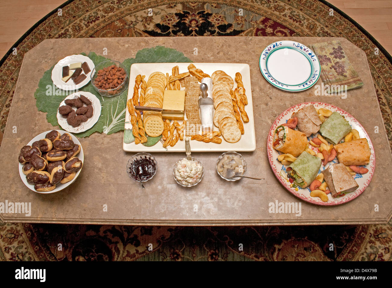 Eclair Rools Table of eclairs, sandwich rolls, candy, cheese, crackers and herring ...