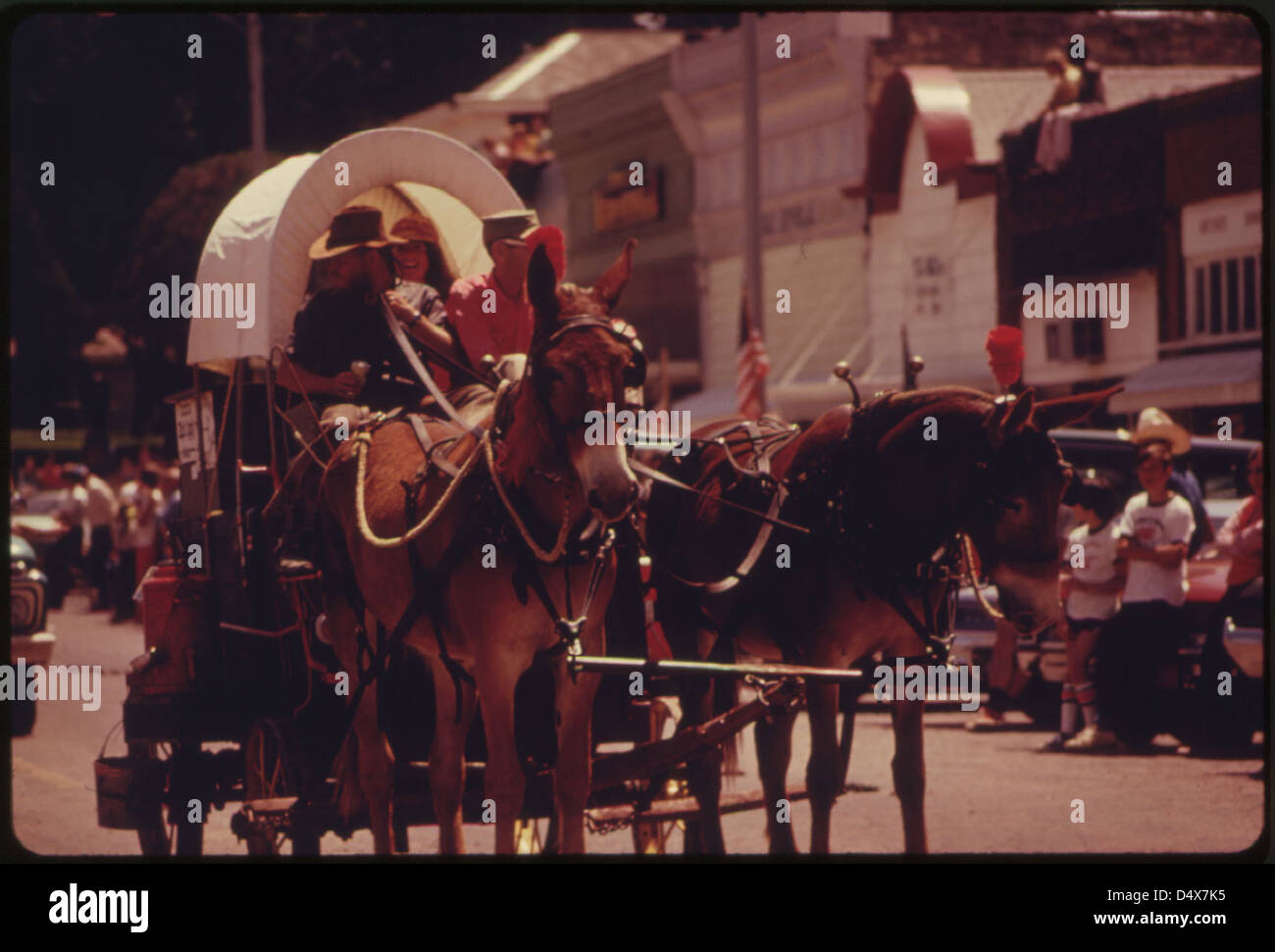 Mule Drawn Covered Wagon Is One of Many Units Which Traveled Down the Main Street of Cottonwood Falls, Kansas, near Emporia, During an Annual Parade...06/1974 Stock Photo