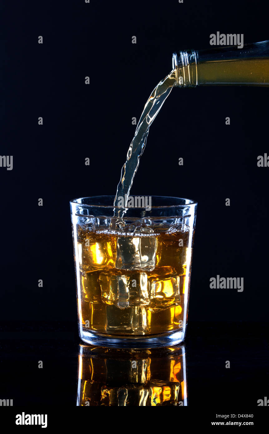 Alcohol against a black background. Stock Photo