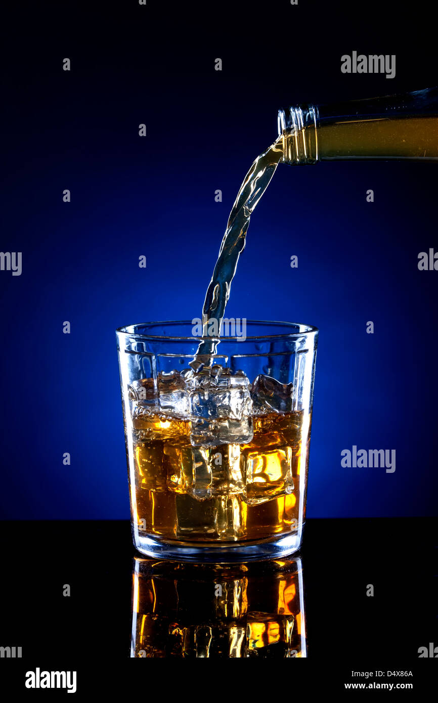 Small glass of poured alcohol. Stock Photo