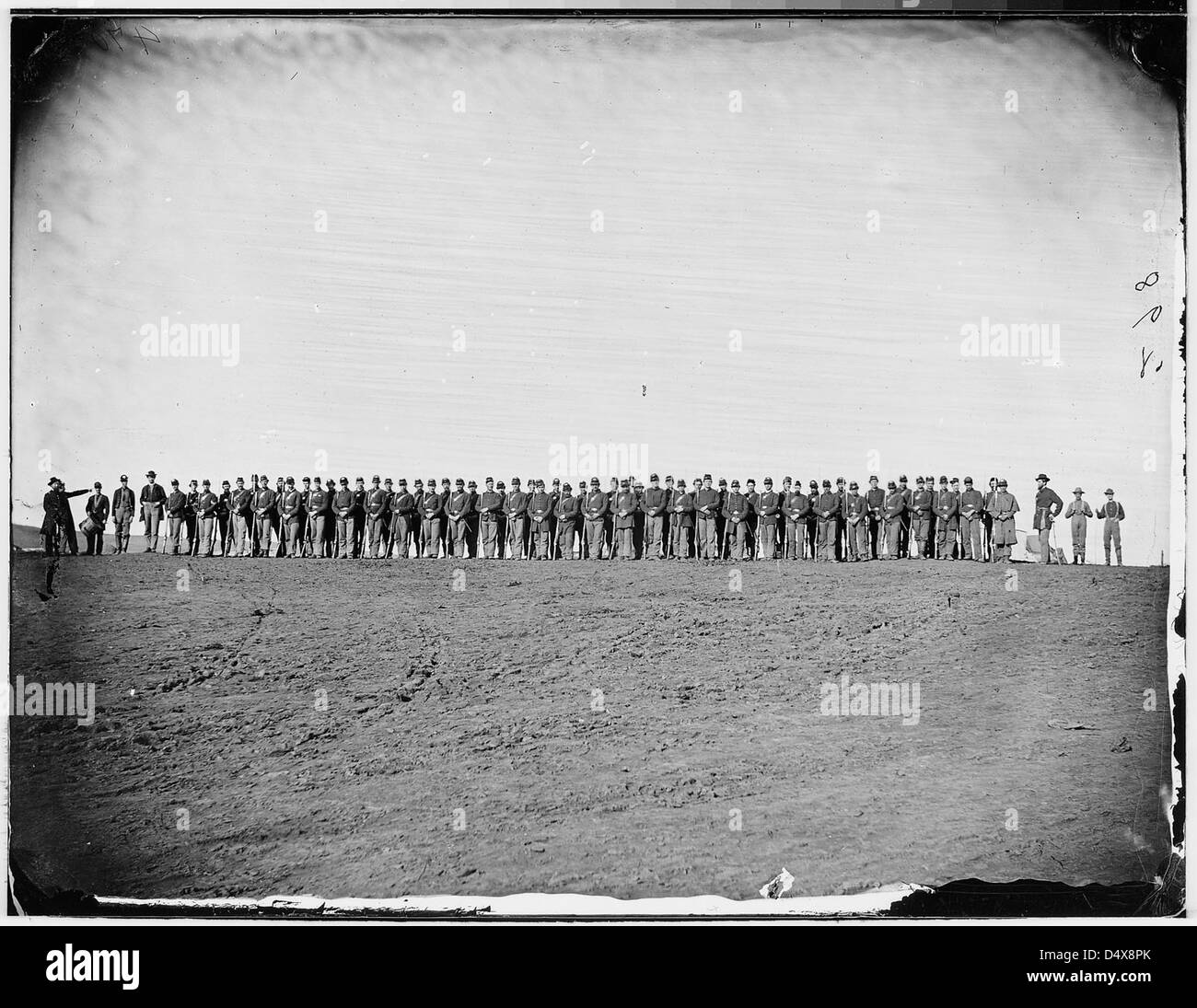 A photograph of infantry soldiers parading during the Civil War, taken by Mathew Brady, showing the military procession and the soldiers involved in the conflict. Stock Photo