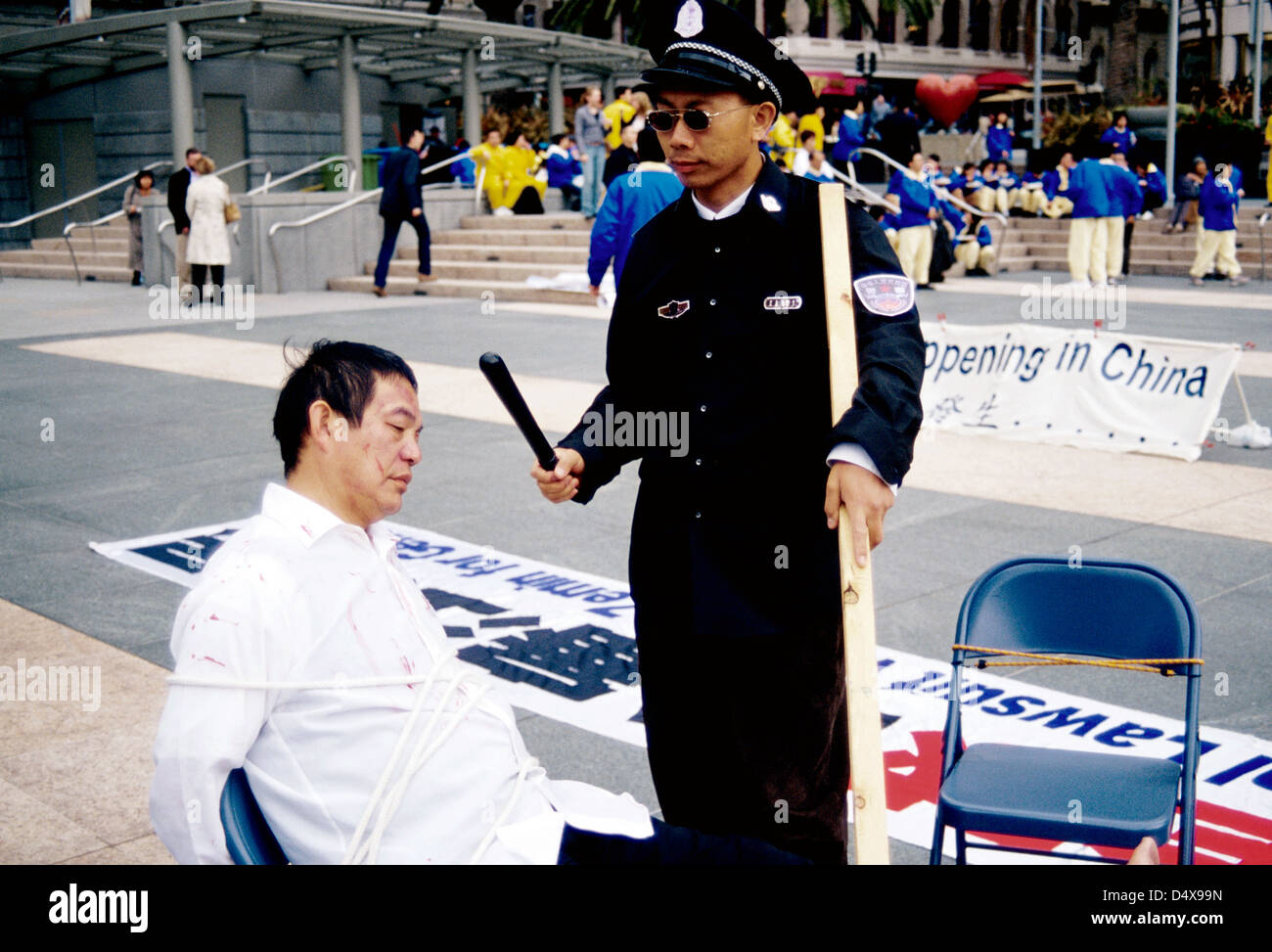 anti china demonstrators reenact torture of Falun gong members in Union Square San Francisco Stock Photo