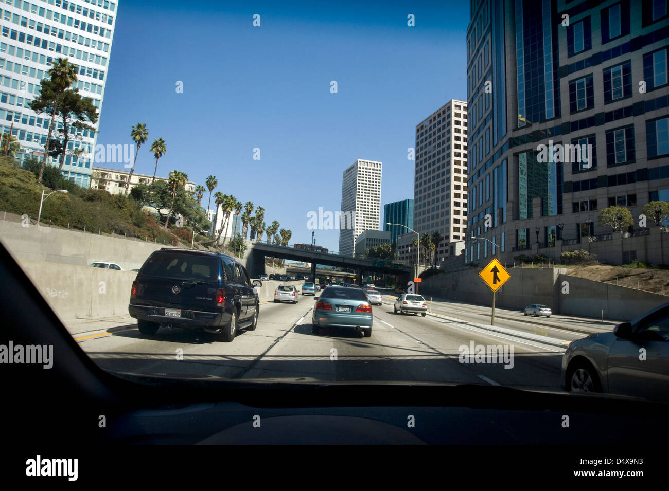 View of freeway in downtown Los Angeles through windshield of car Stock Photo