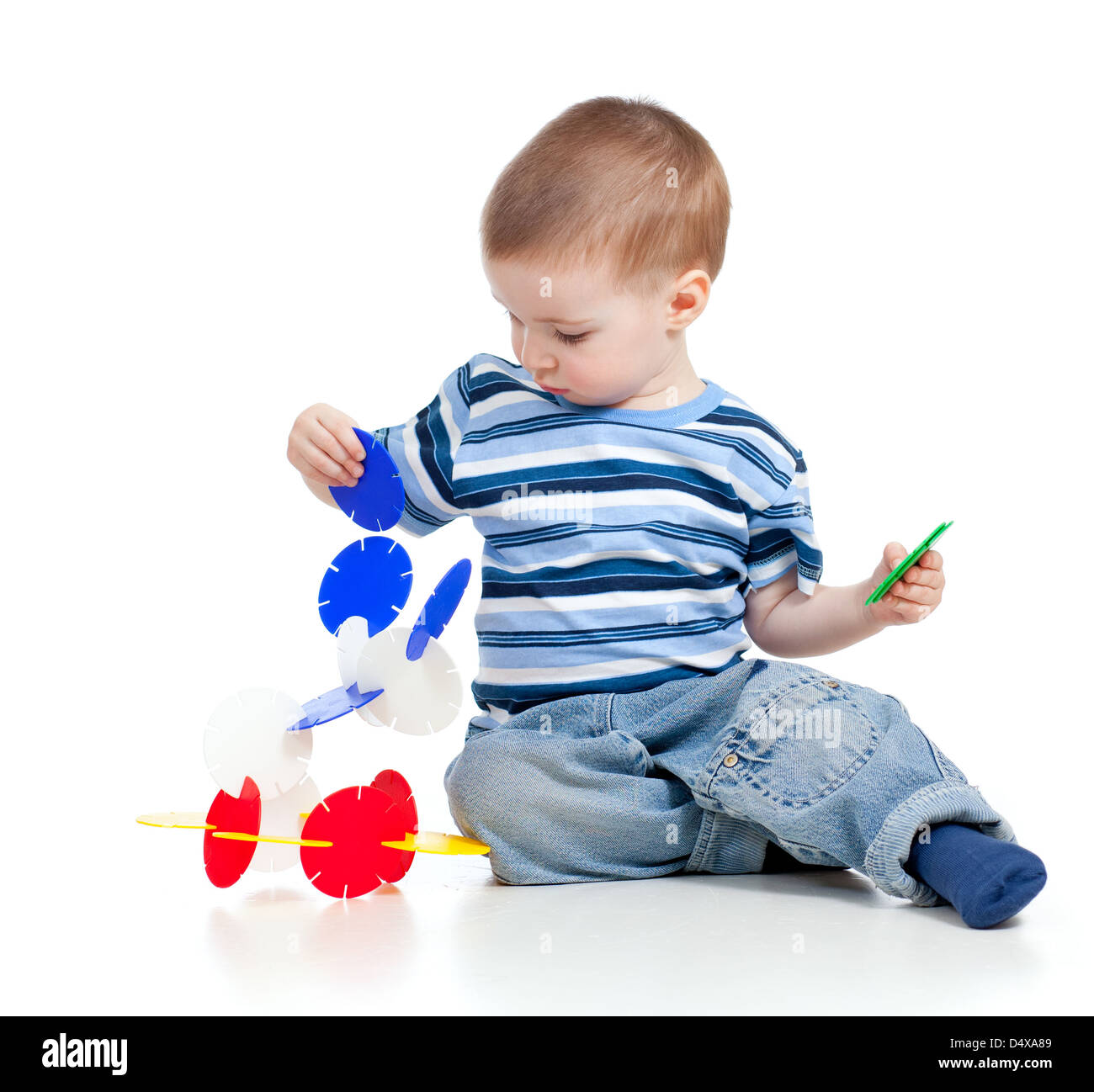 little child playing with color toy over white background Stock Photo ...
