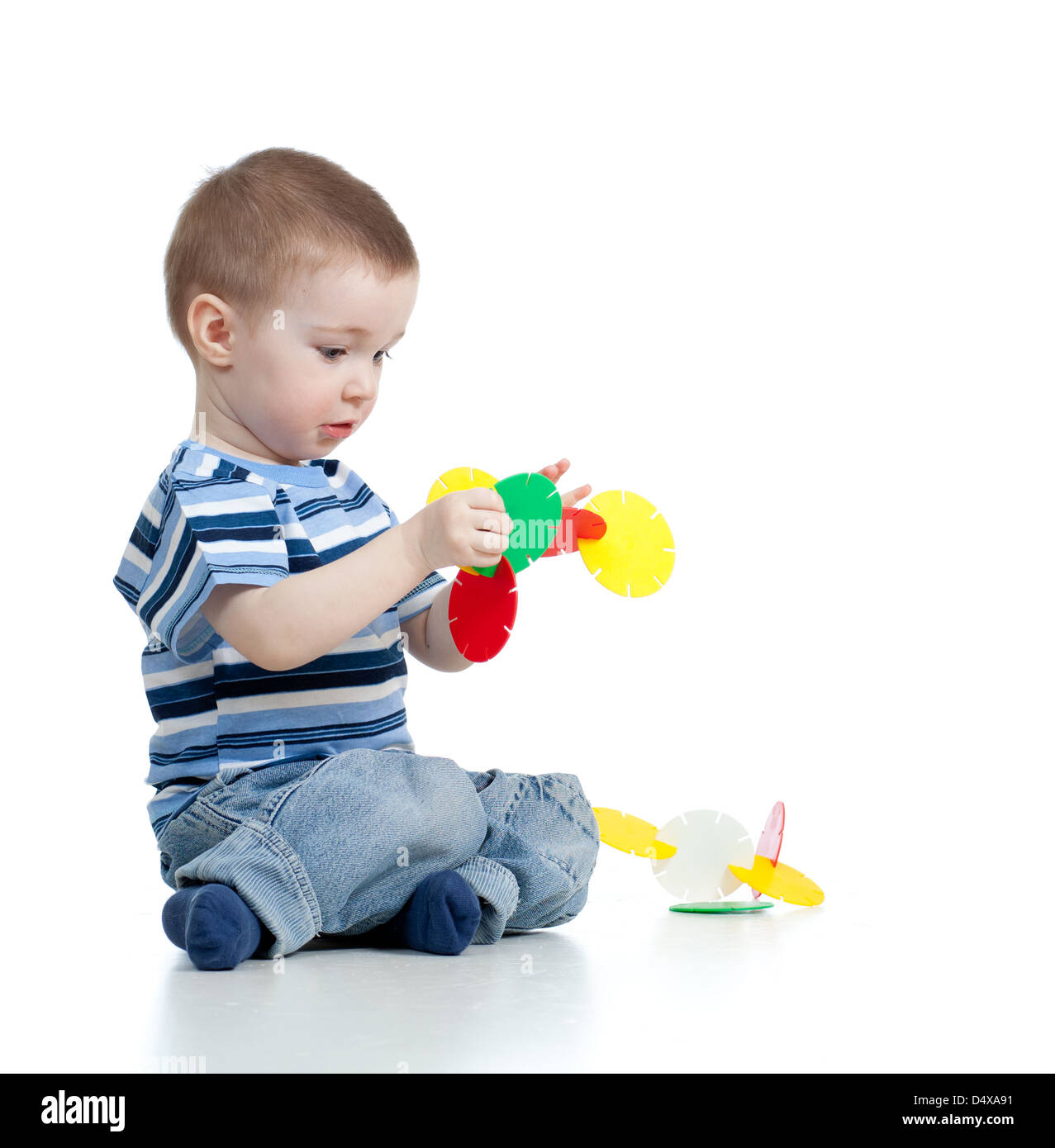little child playing with color toy over white background Stock Photo ...
