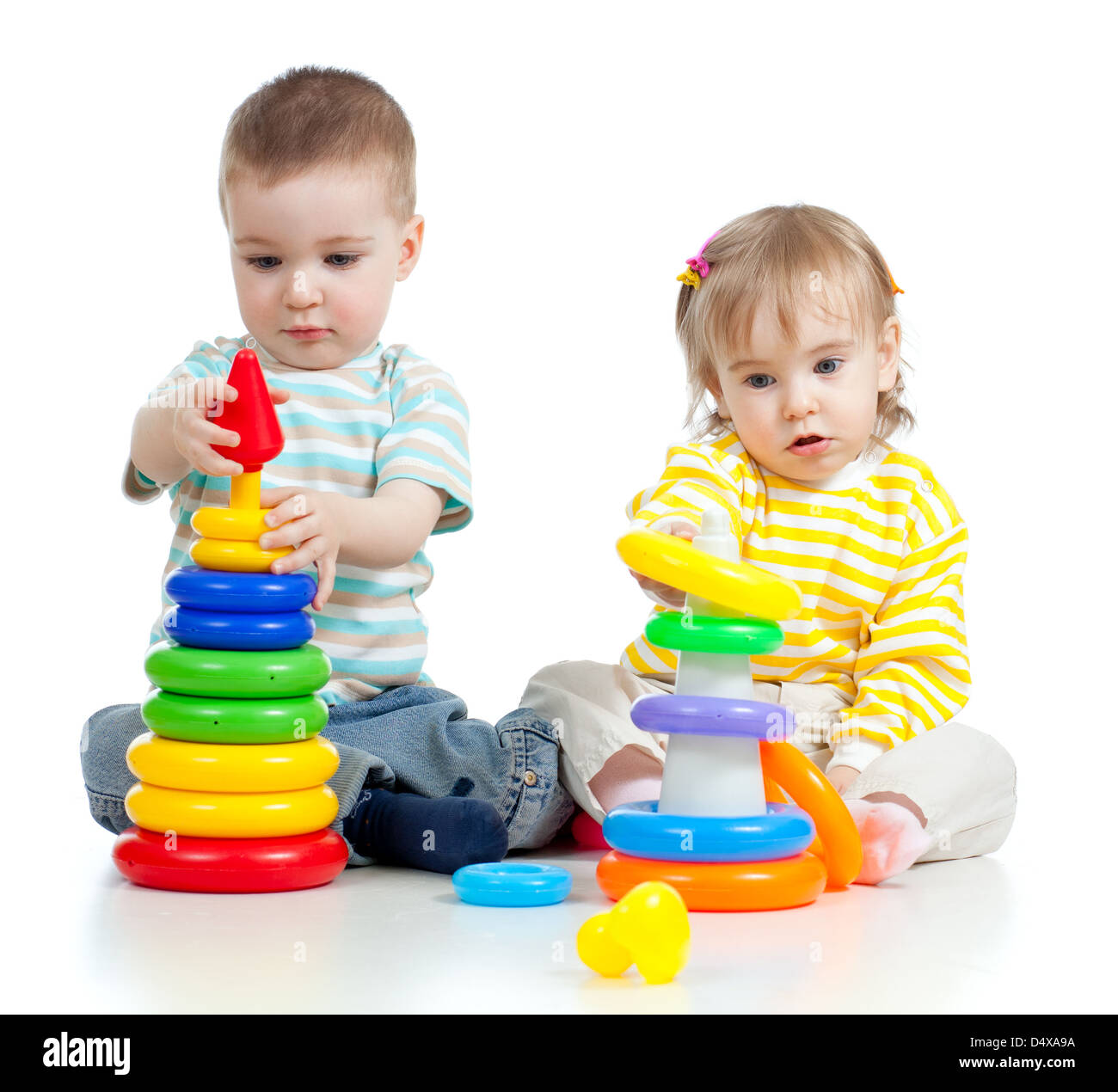 two little children playing with color toys Stock Photo - Alamy