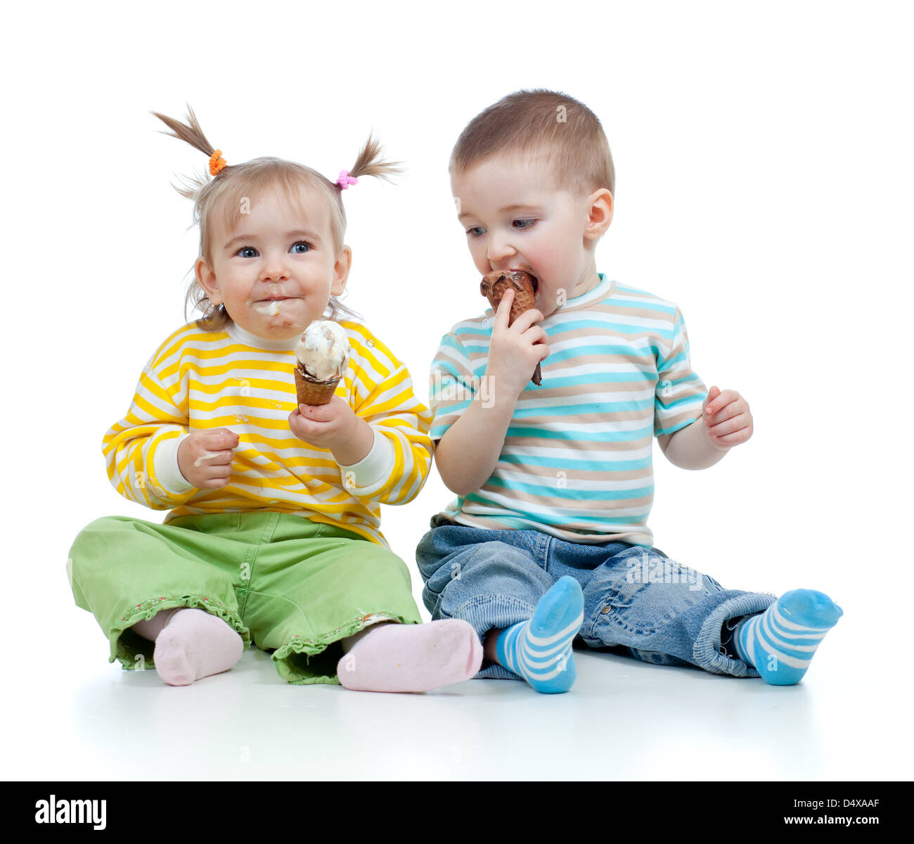 happy children little girl and boy with ice cream in studio isolated Stock Photo