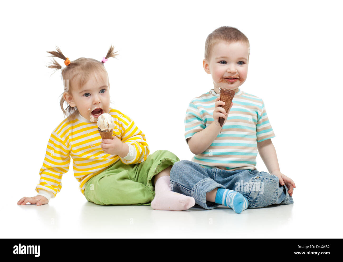 happy children little girl and boy with ice cream in studio isolated Stock Photo