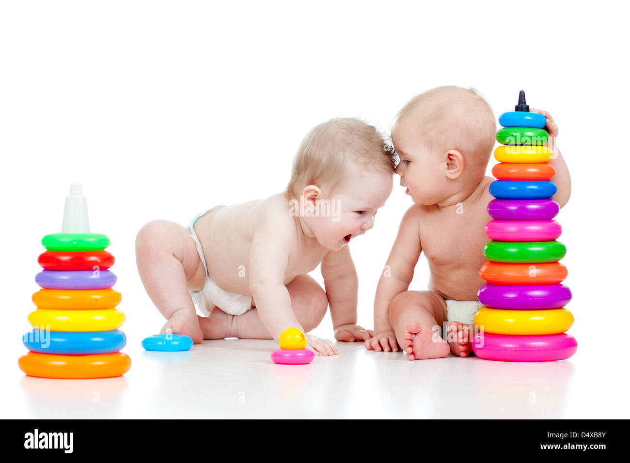 two little children playing with color toys Stock Photo - Alamy
