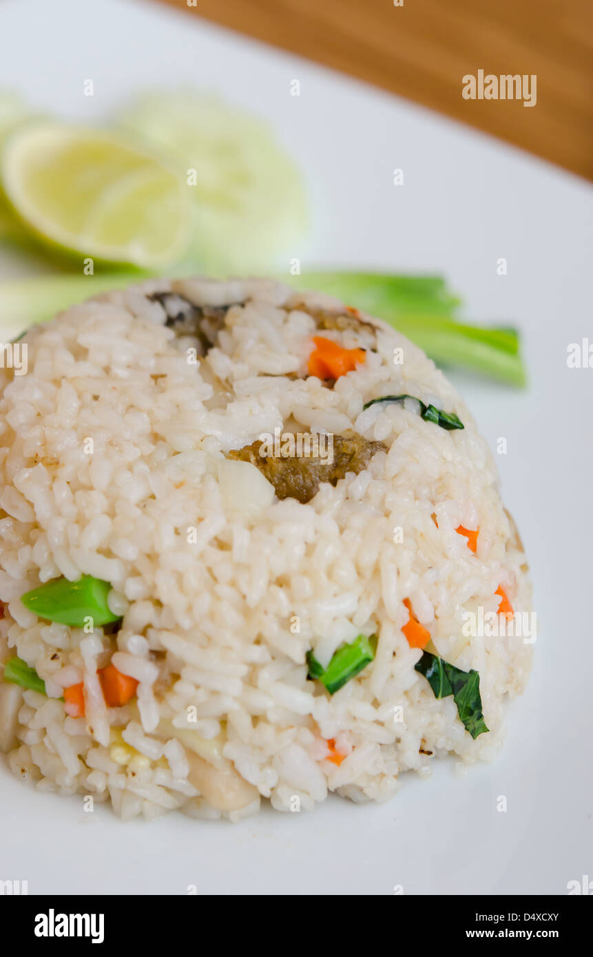 Mixed Cooked Rice Mixed cooked rice with fried fish , sauce and vegetable Stock Photo - Alamy