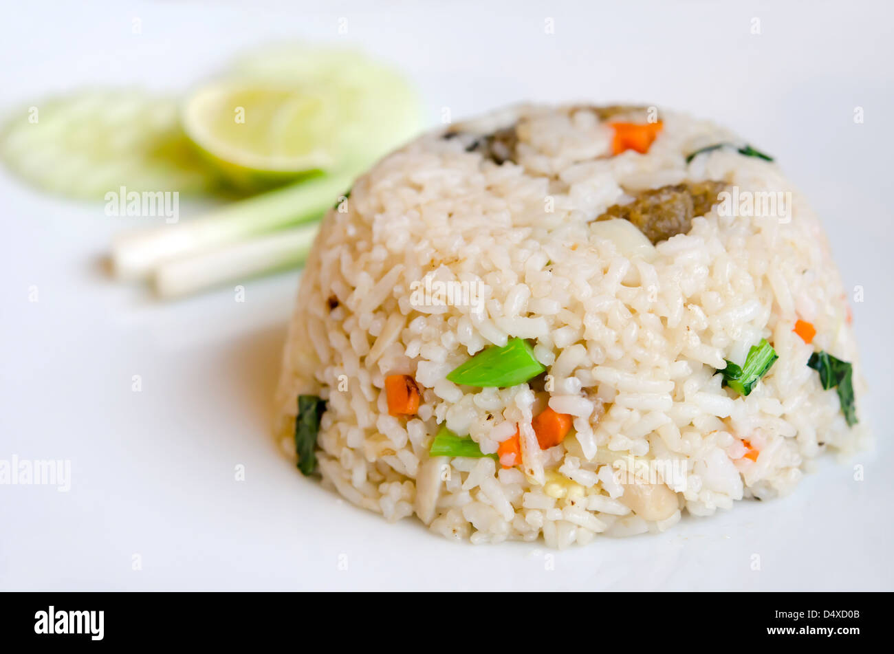 close up mixed cooked rice with fried fish and sauce , served with ...