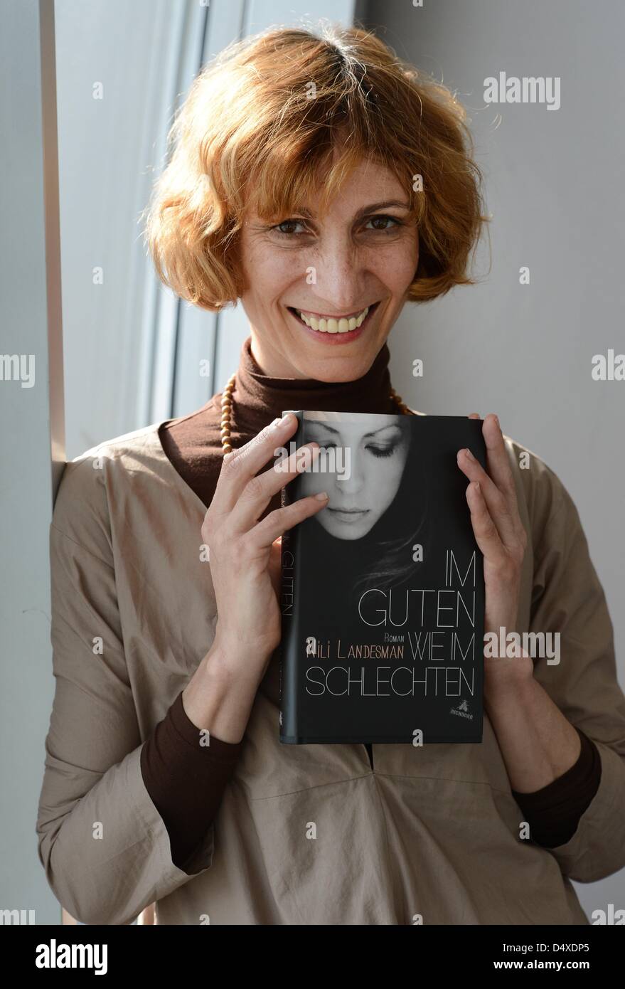 Israeli Nilli Israeli writer Nili Landesman poses with her book 'Im Guten wie im ...