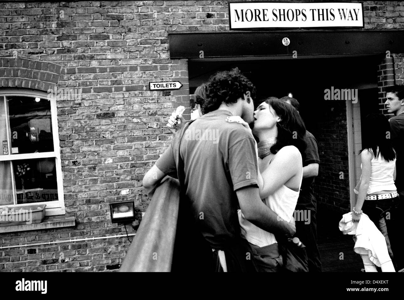 A couple kissing, Camden Lock market, Camden Town, London, UK. Stock Photo
