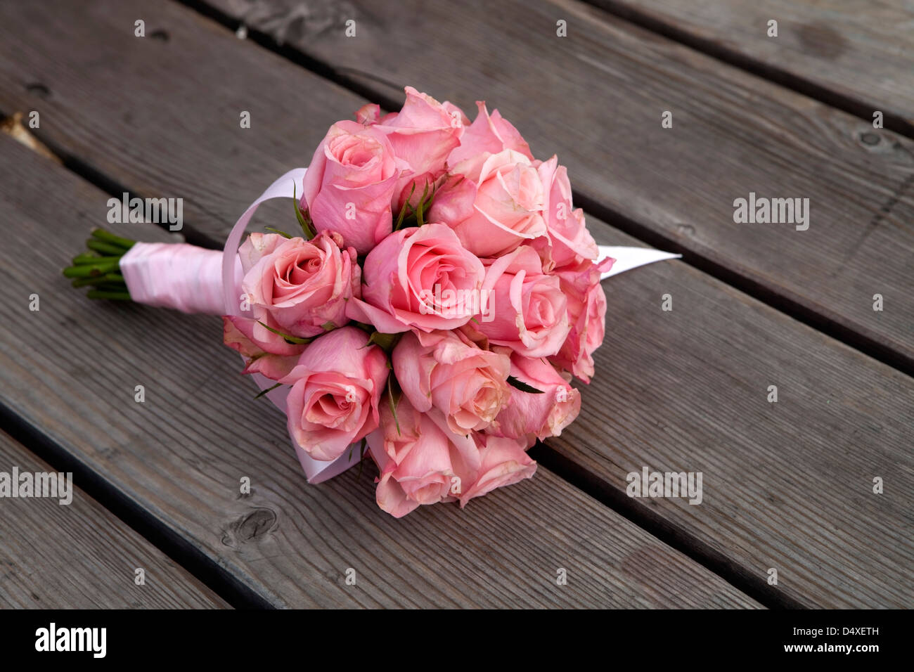 wedding flowers lying on wood floor Stock Photo